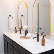 Double vanity with brass details in a modern bathroom