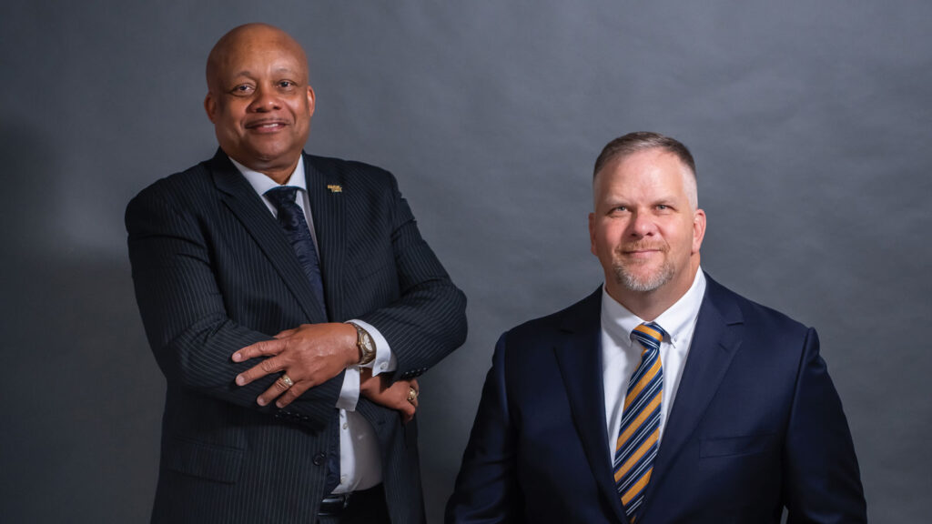 headshot of Dr Brian Yearwood and Mathew Gass