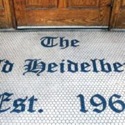 The entrance to The Heidelberg in Columbia, Missouri, has a tile welcome that reads "The Old Heidelberg Est. 1963."