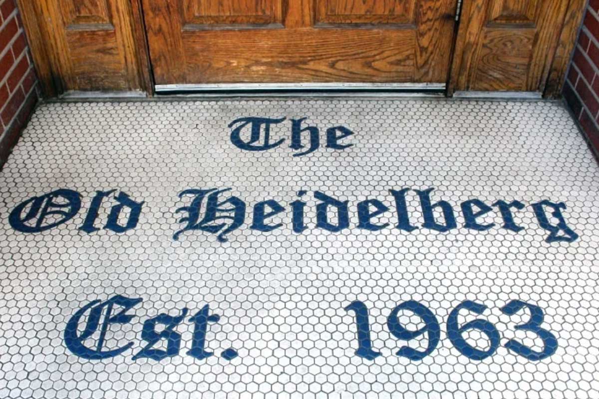 The entrance to The Heidelberg in Columbia, Missouri, has a tile welcome that reads "The Old Heidelberg Est. 1963."