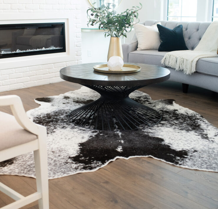 Living room coffee table on a cowhide rug