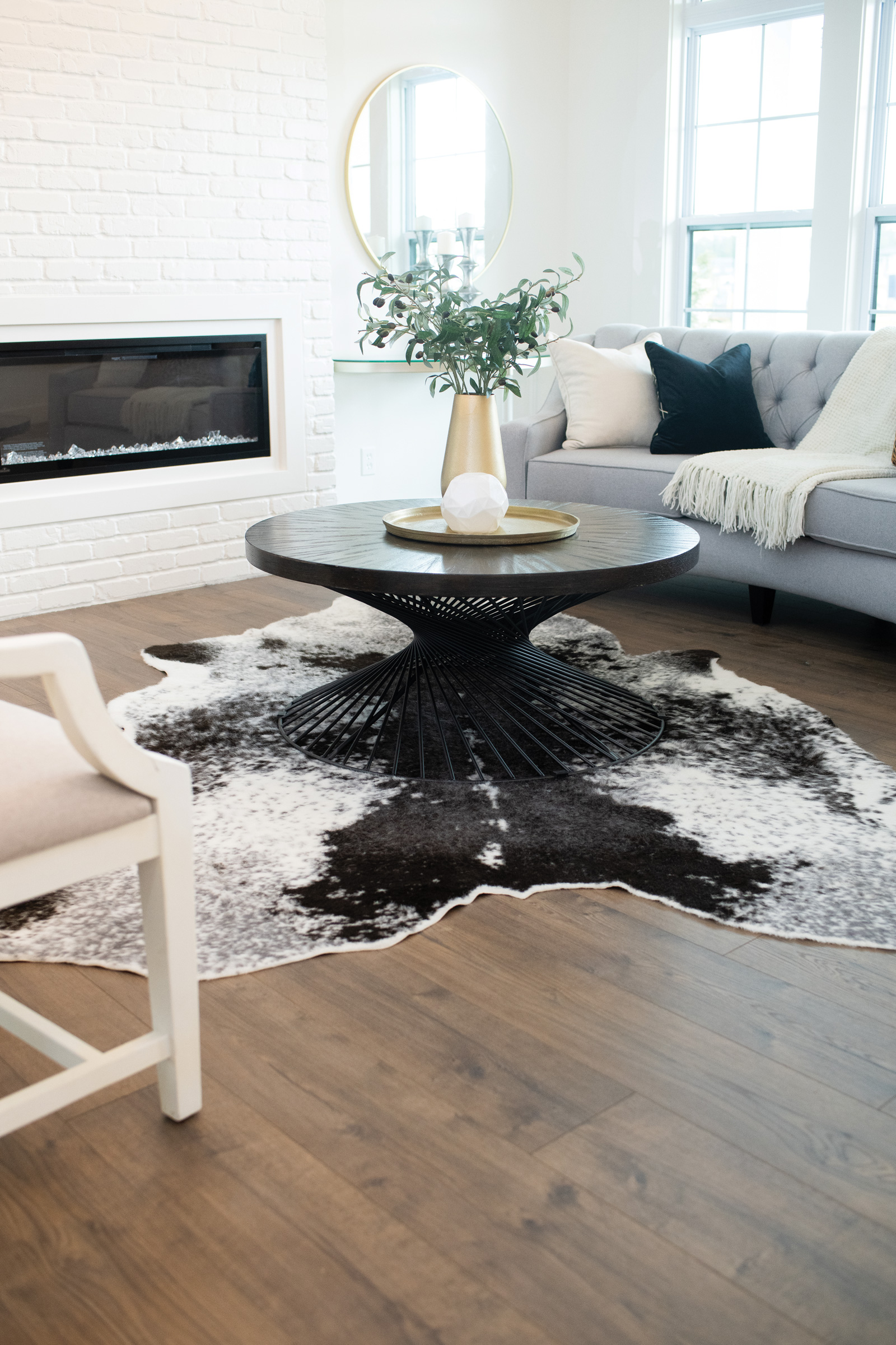 Living room coffee table on a cowhide rug