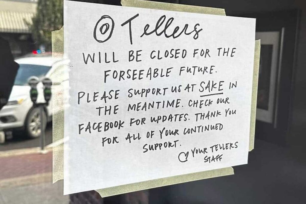 A sign on the front door of Tellers Gallery and Bar tells customers the business will be closed to make repairs from fire, smoke, and water damage.