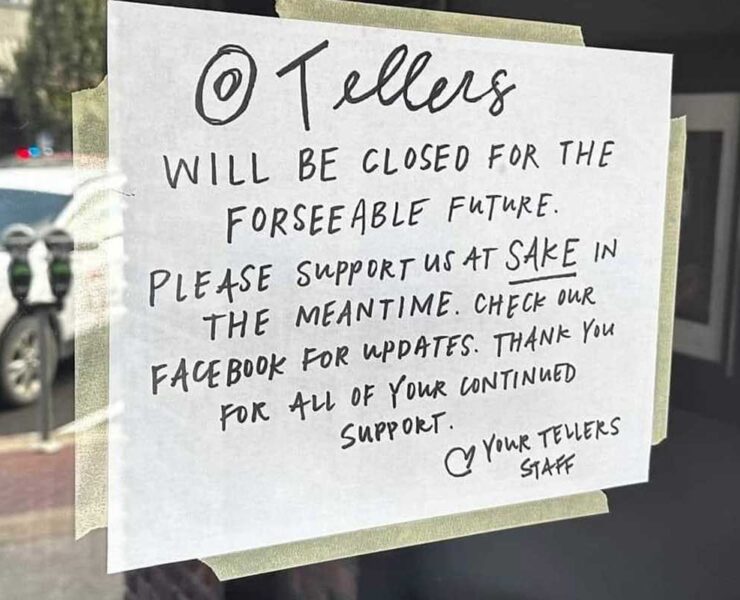 A sign on the front door of Tellers Gallery and Bar tells customers the business will be closed to make repairs from fire, smoke, and water damage.