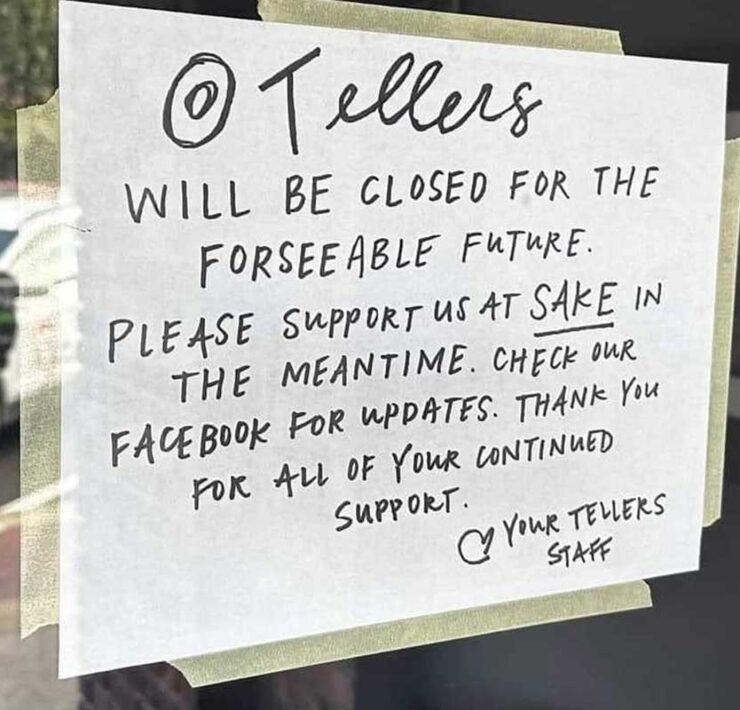 A sign on the front door of Tellers Gallery and Bar tells customers the business will be closed to make repairs from fire, smoke, and water damage.