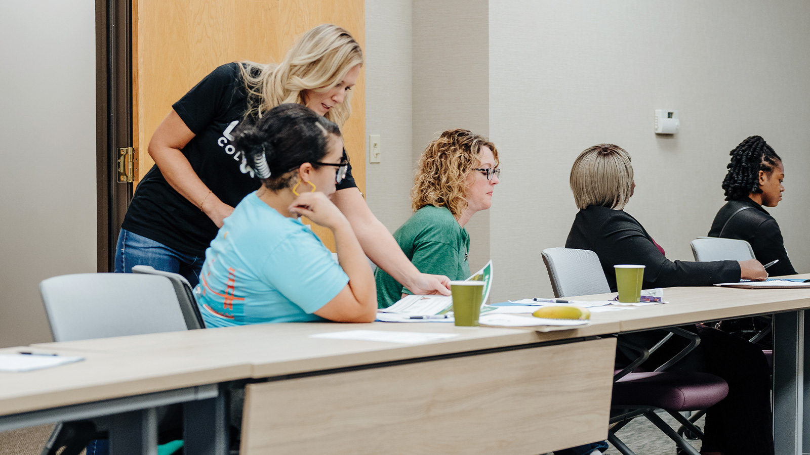 Instructor interacts with participants at Love Columbia financial class