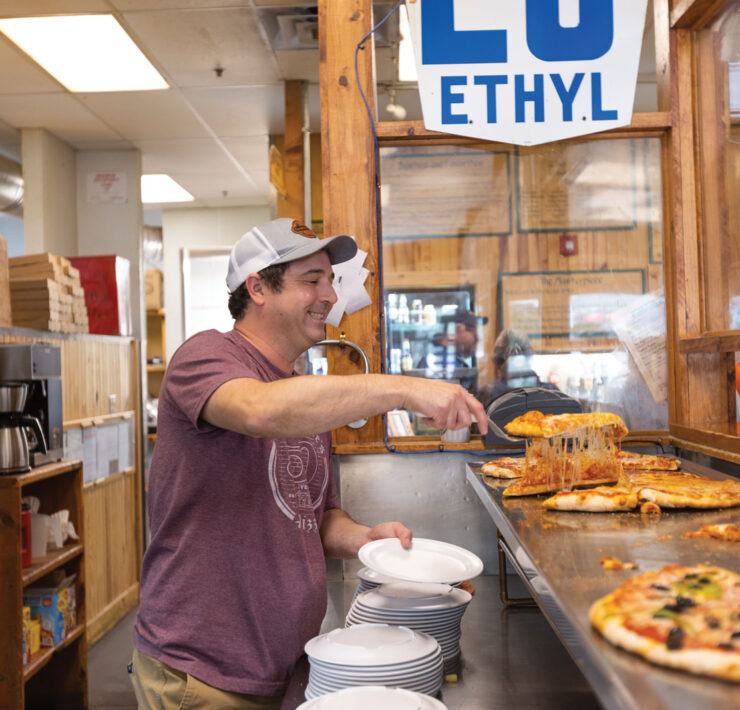 Toby Epstein Serving Pizza