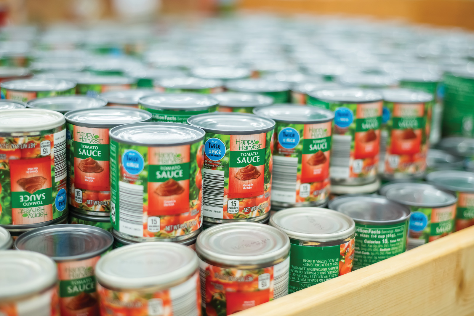 Product display of canned tomato sauce
