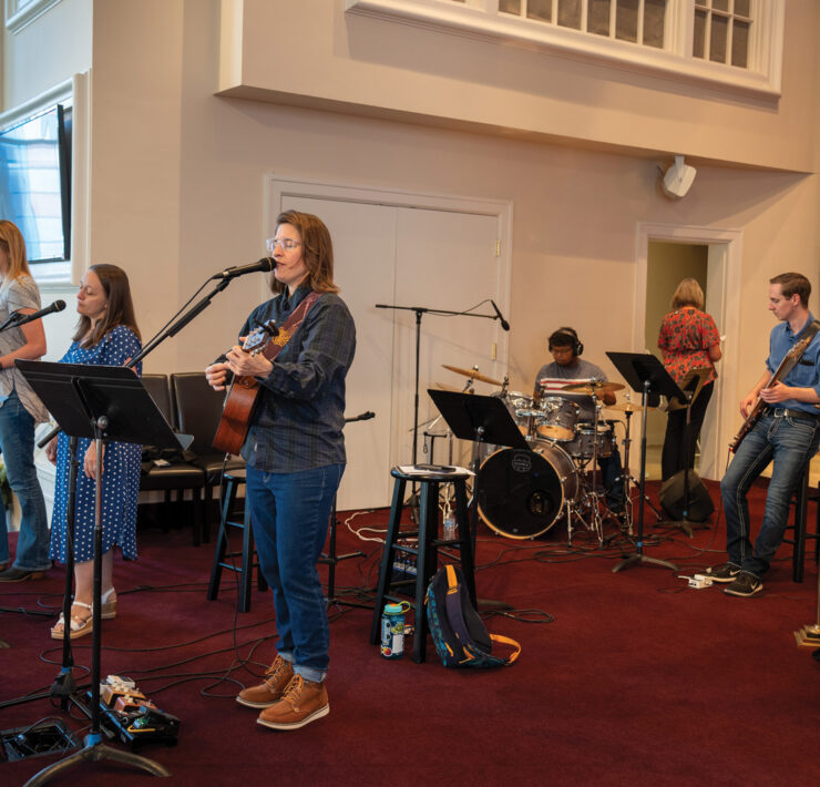 Worship Team Performs Music On Stage