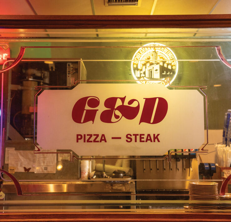 G&D Pizzaria mirrored sign
