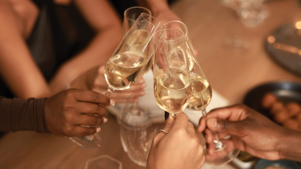 Group of friends toasting champagne glasses