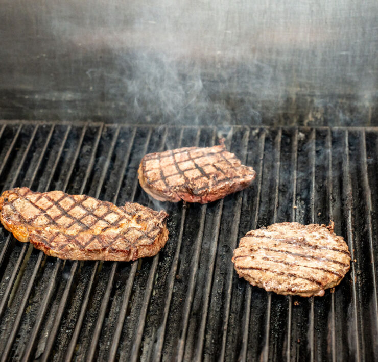 Meat on the grill at G&D Steakhouse