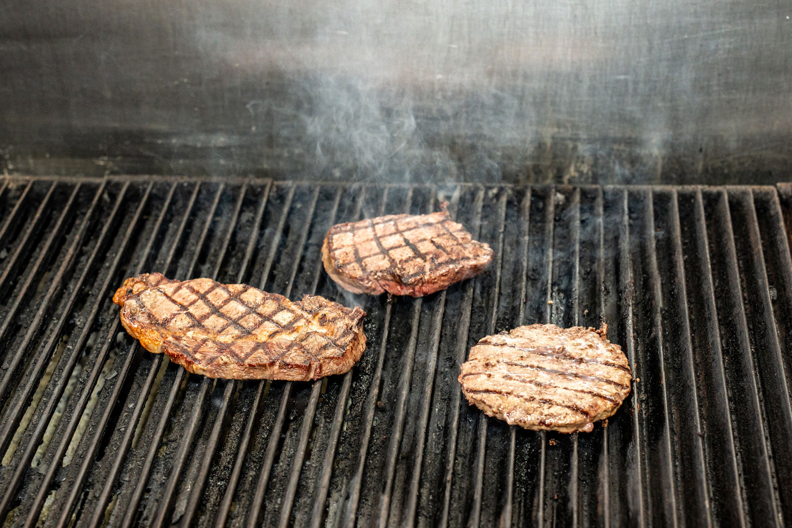 Meat on the grill at G&D Steakhouse