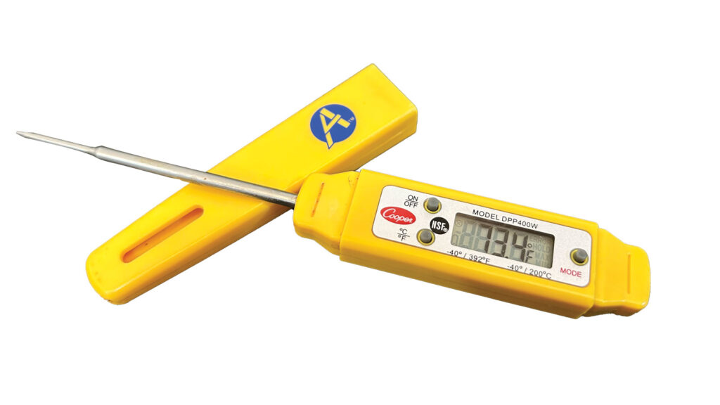 Bright yellow digital meat thermometer resting on its lid.