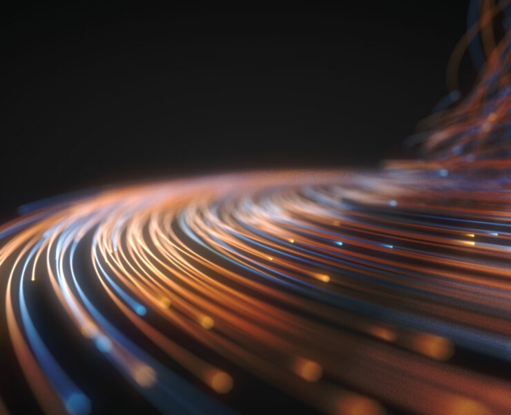 Glowing fiber optic strings on a black background.
