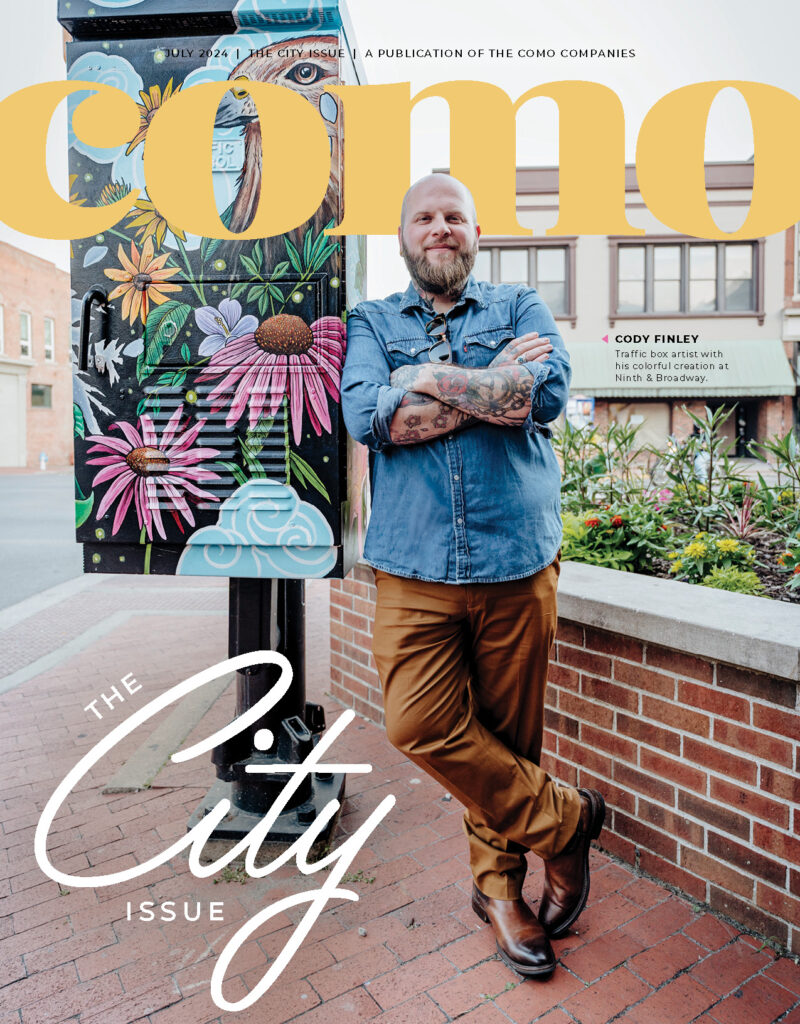 COMO Magazine's City issue featuring Cody Finley, traffic box artist by the box at Ninth and Broadway. Photo by Charles Bruce III.