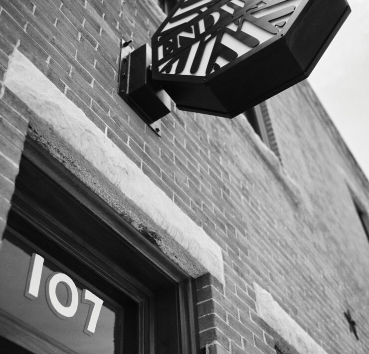 Endwell Taverna exterior looking up at the sign