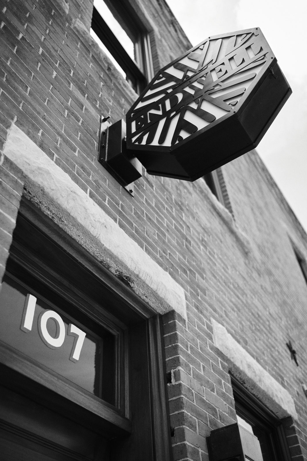 Endwell Taverna exterior looking up at the sign