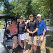 Erica Golfing With Three Sons