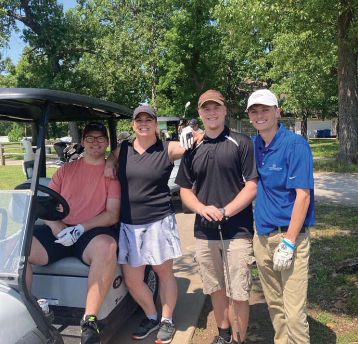 Erica Golfing With Three Sons