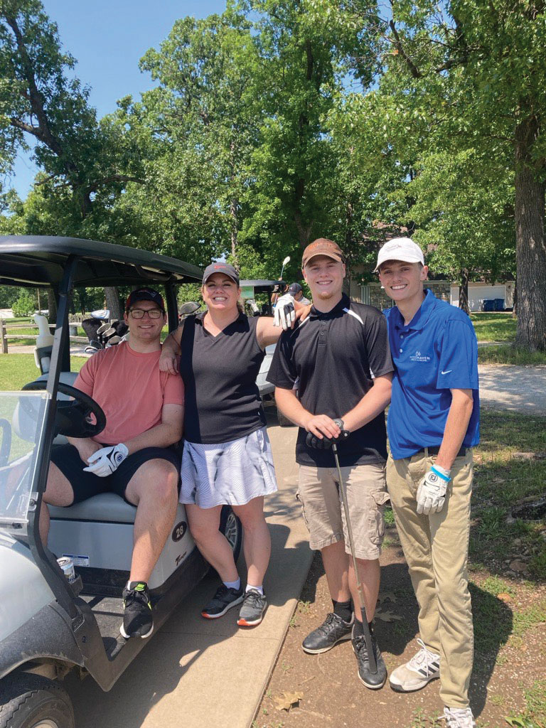 Erica Golfing With Three Sons