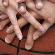 Hands in on a basketball