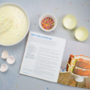 Samantha Dillard's Confetti Cake ingredients, her cookbook lay open beside.