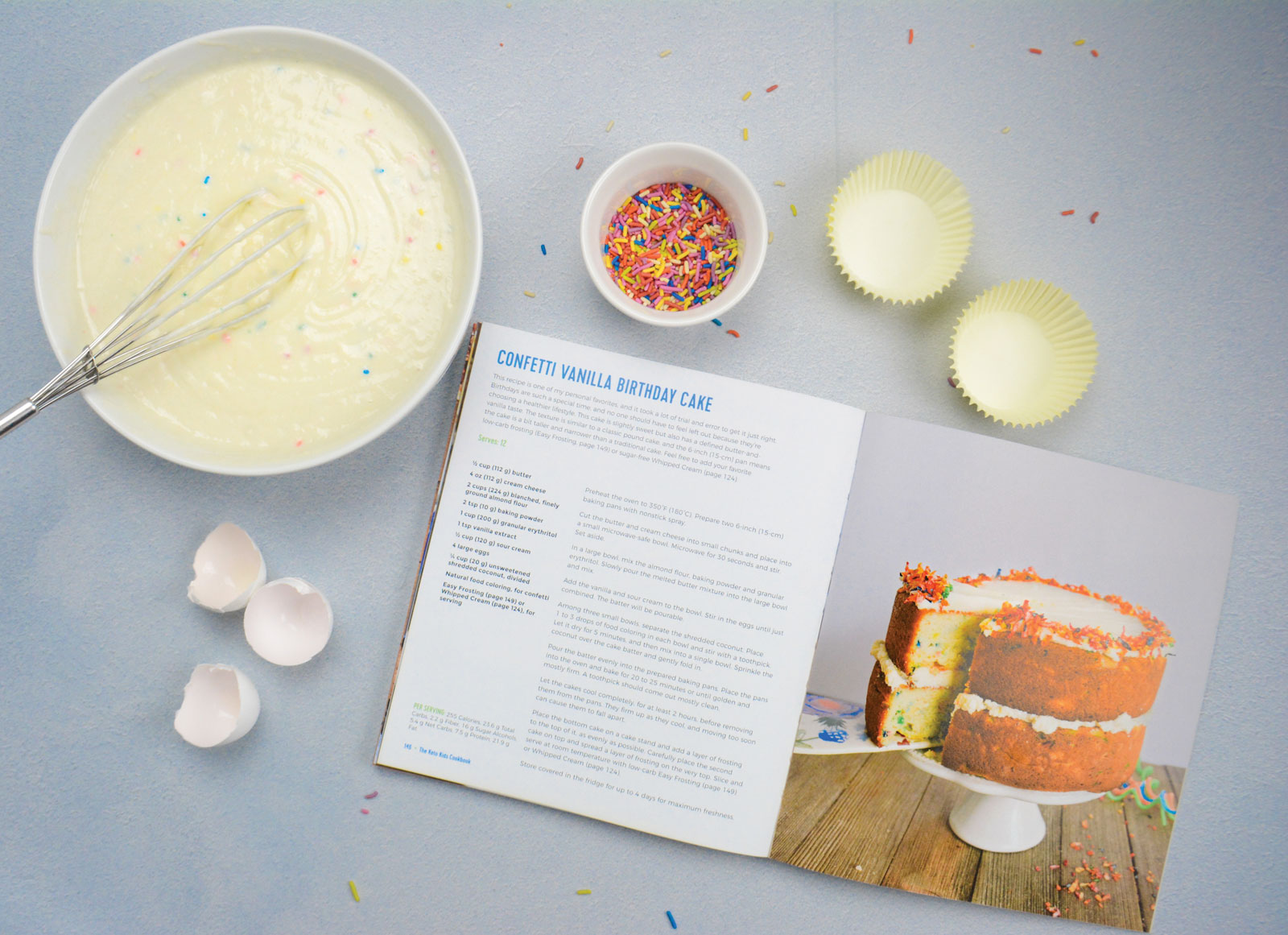 Samantha Dillard's Confetti Cake ingredients, her cookbook lay open beside.