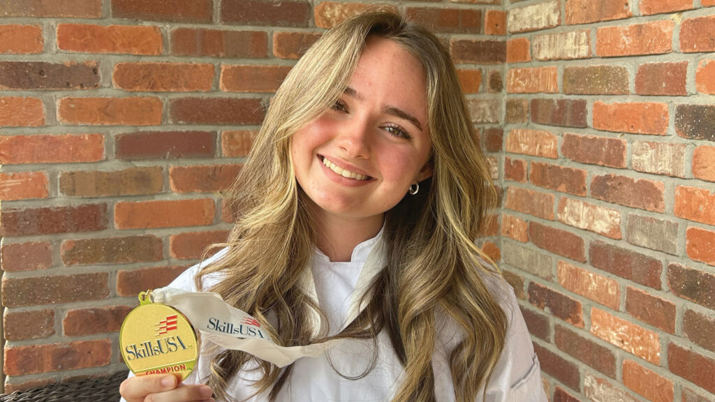 Sydney Bliss with her first place medal in SkillsUSA