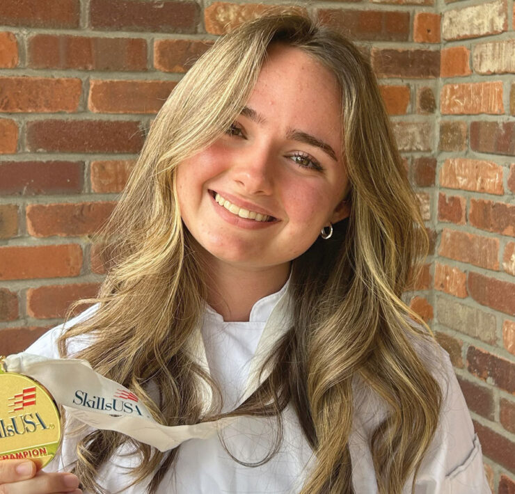 Sydney Bliss with her first place medal in SkillsUSA