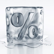 Illustration of ice cube with percentage sign carved into it and ice melting