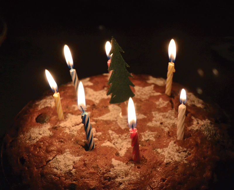 Candles lit on a traditional Korean Christmas cake.