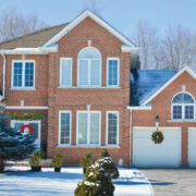 Bev And Co Exterior Of A Brick Home In The Snow Decorated For The Holidays