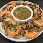 A Platter Of Bbq Shrimp And Sauce Prepared By Hoss