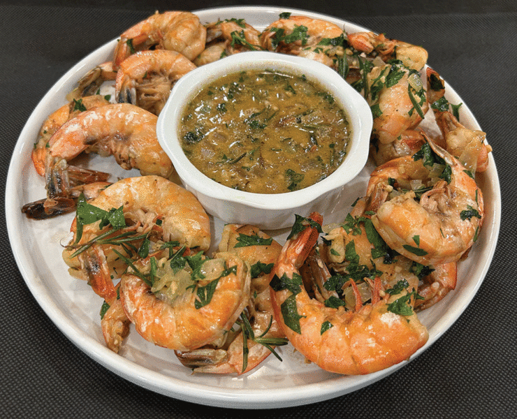 A Platter Of Bbq Shrimp And Sauce Prepared By Hoss