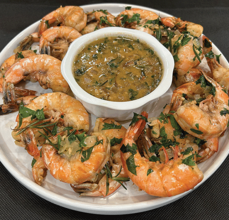 A Platter Of Bbq Shrimp And Sauce Prepared By Hoss