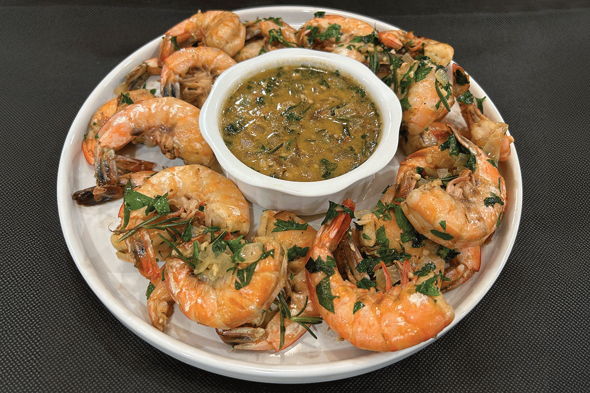 A Platter Of Bbq Shrimp And Sauce Prepared By Hoss