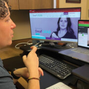 Featured Person Using American Sign Language To Assist A Caller On A Video Crisis Line Call (1)