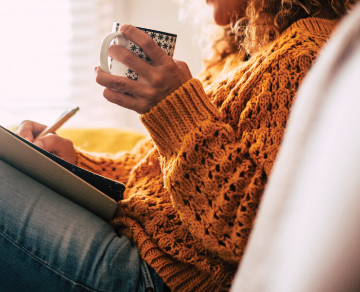 Featured Woman Writing In A Journal While Drinking Coffee