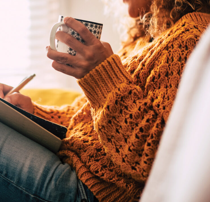 Featured Woman Writing In A Journal While Drinking Coffee