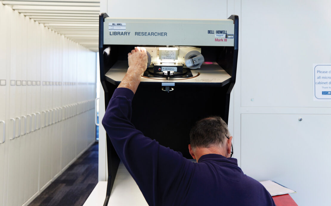 Featured A Researcher Using A Microfilm Machine