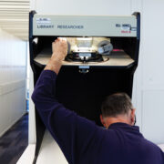 Featured A Researcher Using A Microfilm Machine