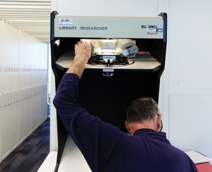 Featured A Researcher Using A Microfilm Machine