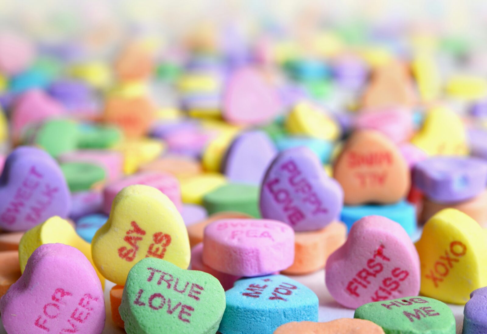 an assortment of valentines style candy hearts