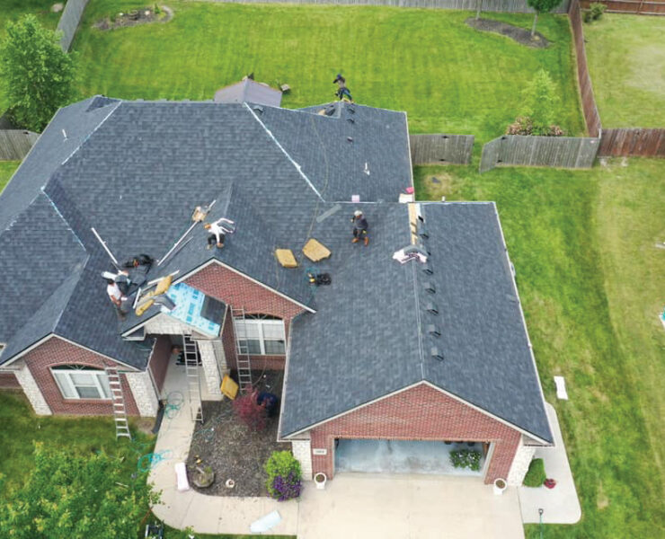 Overhead View Of Roofing Project With People