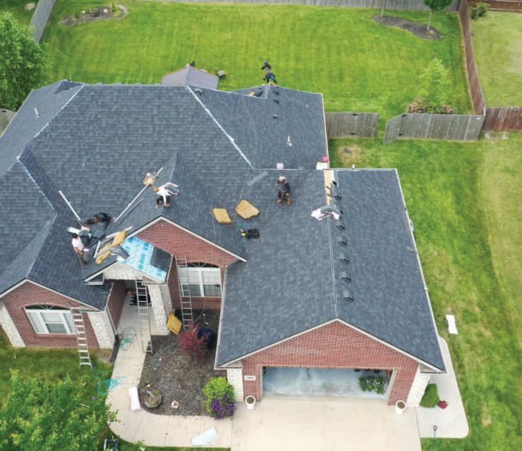 Overhead View Of Roofing Project With People