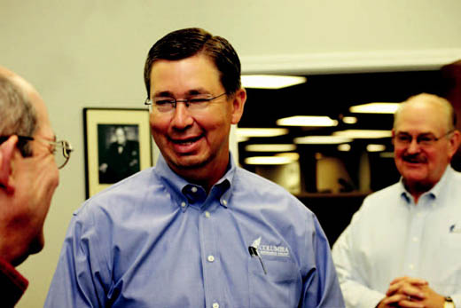 Gary Thompson discusses a claims loss with Jon Erickson.
