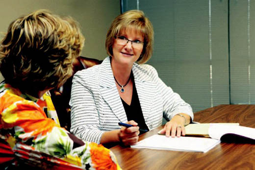 Edington reviews the results of a tax return with client.