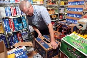 Mike Ginter delivers Bud Ice to the cooler of Loop Liquor. Mike Ginter delivers Bud Ice to the cooler of Loop Liquor.