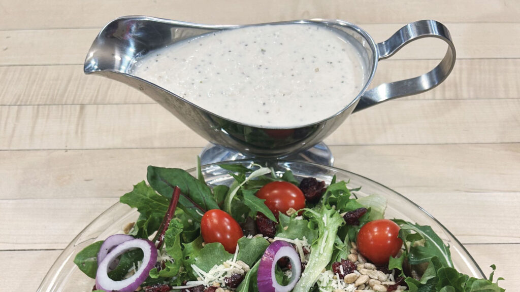 Featured A Sauciere Full Of Hoss Market Creamy Onion Dressing Next To A Bowl Of Market Harvest Salad